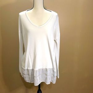 White long sleeve top with sheer panel at bottom